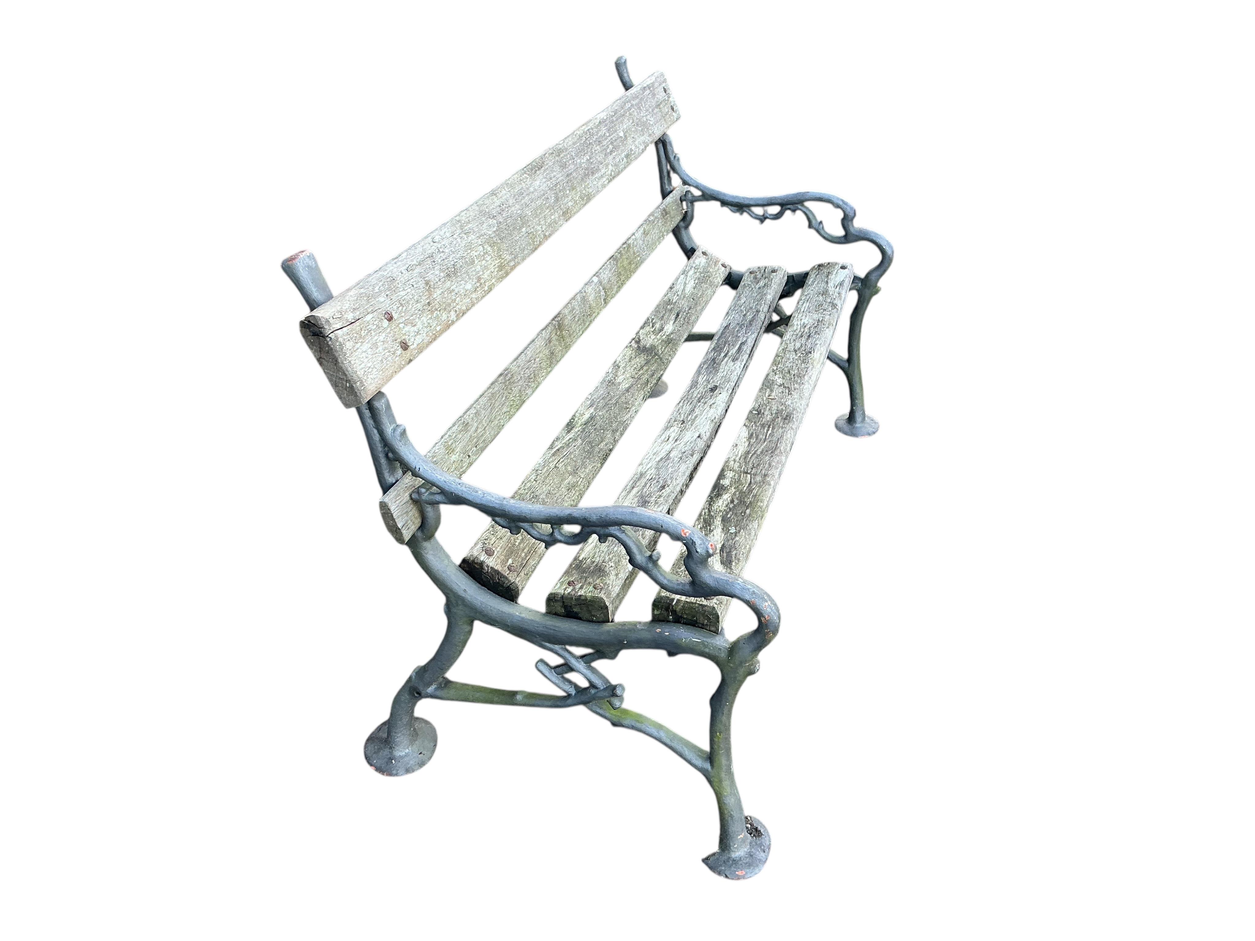 A Coalbrookdale style slatted cast iron garden bench, width 152cm, depth 66cm, height 82cm